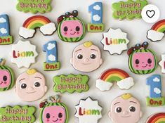 decorated cookies are arranged in the shape of children's first birthdays and numbers