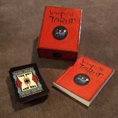 the vampire tarot and other games are on the floor