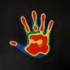 an image of a hand painted with colored paint on black paper and blue, green, red, yellow and orange colors