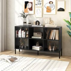 a black bookcase with books on it in a living room next to a potted plant