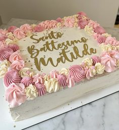 a birthday cake with pink and white frosting on top that says suites, butterscoam matilda