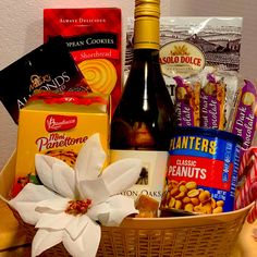 a basket filled with lots of different types of food and drinks on top of a table