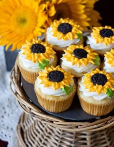 cupcakes decorated with sunflowers on a wicker basket