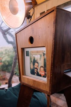 an old wooden box with a photo in it