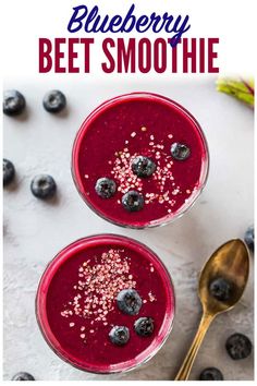 two glasses filled with blueberry beet smoothie