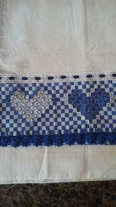 a blue and white piece of cloth on top of a table