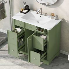 a bathroom vanity with drawers and a mirror on the wall next to it is shown