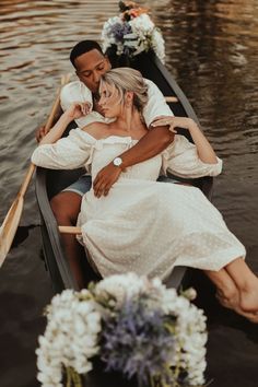 a man and woman are sitting in a boat