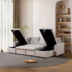 a living room with a couch that has two open cases on the top of it