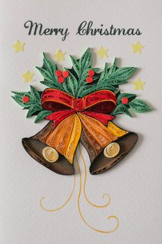 a christmas card with two bells and holly leaves