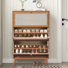 a wooden shoe rack filled with lots of shoes