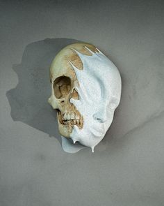 a fake human skull with white paint on it