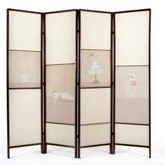 a room divider with four panels and pictures on it