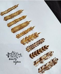 gold leaf stickers on white paper with black background