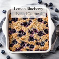 lemon blueberry baked oatmeal in a casserole dish with fresh blueberries