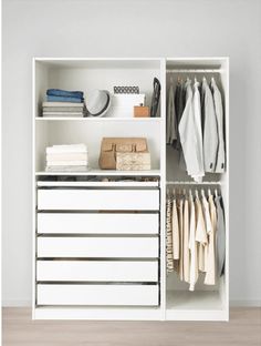 an organized closet with white drawers and clothes