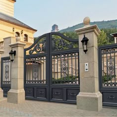 an iron gate is shown in front of a building