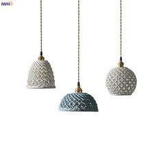 three white and blue lamps hanging from chains