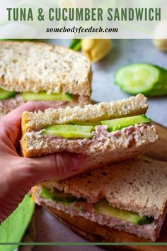 a sandwich with tuna and cucumber on it