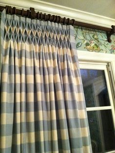 the curtains are hanging in front of the window