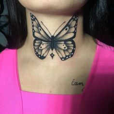 a woman's neck with a butterfly tattoo on her left side and the words can be seen above it