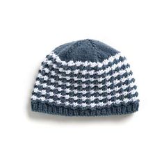 a blue and white knitted hat on a white background