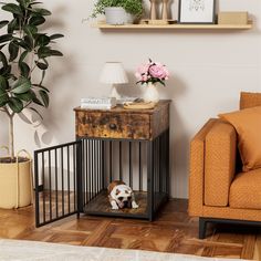 a small dog sitting in a cage next to a couch and table with flowers on it