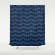 a blue shower curtain with wavy waves on it