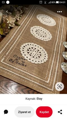 a table runner with doily on it is shown in the app store's facebook page