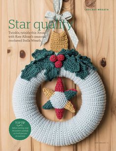 a crocheted christmas wreath with a star hanging from it