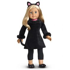 a doll with blonde hair wearing a black cat outfit