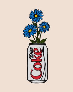 a can filled with blue flowers sitting on top of a table