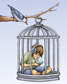 a boy is sitting in a bird cage and listening to music