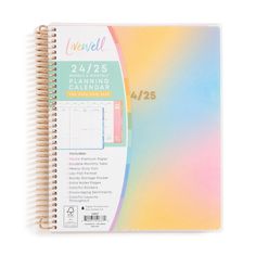 a spiral bound planner with rainbow colored paper