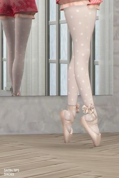 a pair of women's legs with polka dot tights and ballet shoes in front of a mirror