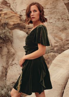 You'll want to jet set off to vacation or the Italian coast in this fluttery velvet dress, but a cocktail party works too. A muted olive, this ruffle dress features a ruched bodice, flutter sleeves, and a small cut-out above your waist. Also has cascading ruffles on the skirt. Make it your own with sneakers or heels. Designed in Canada, Made in New YorkDETAILS* Center back zipper* Right above knee length* Fully LinedFITTrue to sizeFABRIC + CARECrafted with detail, please love your garment with c Velvet Green Dress, Stretch Velvet Dress, Italian Coast, Velvet Wrap Dress, Green Velvet Dress, Cascading Ruffles, Ruffle Midi Dress, Summer Capsule Wardrobe, Ruched Bodice