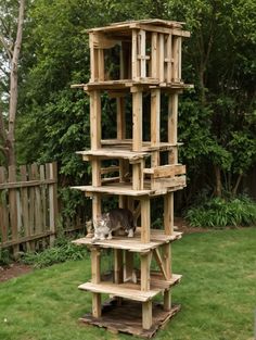 a cat sitting on top of a wooden structure