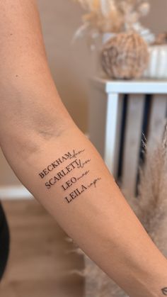 a woman's arm with writing on it