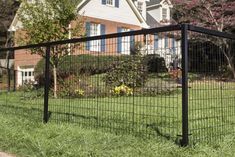 a black fence in front of a house