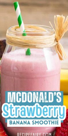 a smoothie in a mason jar with strawberries around it and the words mcdonald's strawberry banana smoothie