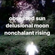 a blurry image of a person walking in the woods with text that reads, obsessed sun delusionnal moon nonchalnt rising