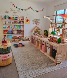 a child's play room with toys and bookshelves