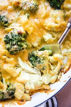 a casserole dish with broccoli and cheese