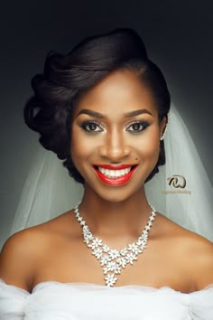 a woman wearing a bridal necklace and wedding dress with red lipstick on her lips