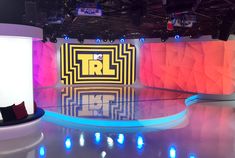 an empty tv studio with bright colored lighting