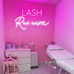 a pink room with a neon sign that says lash rose moon on the wall