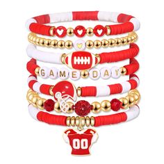 a stack of red and white bracelets with football charms