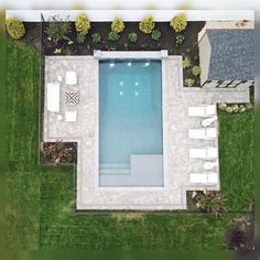 an aerial view of a pool and patio area