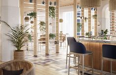 a bar with chairs and plants in it