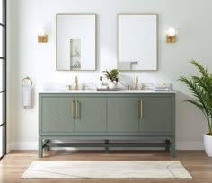 a bathroom with two sinks and mirrors on the wall next to a potted plant